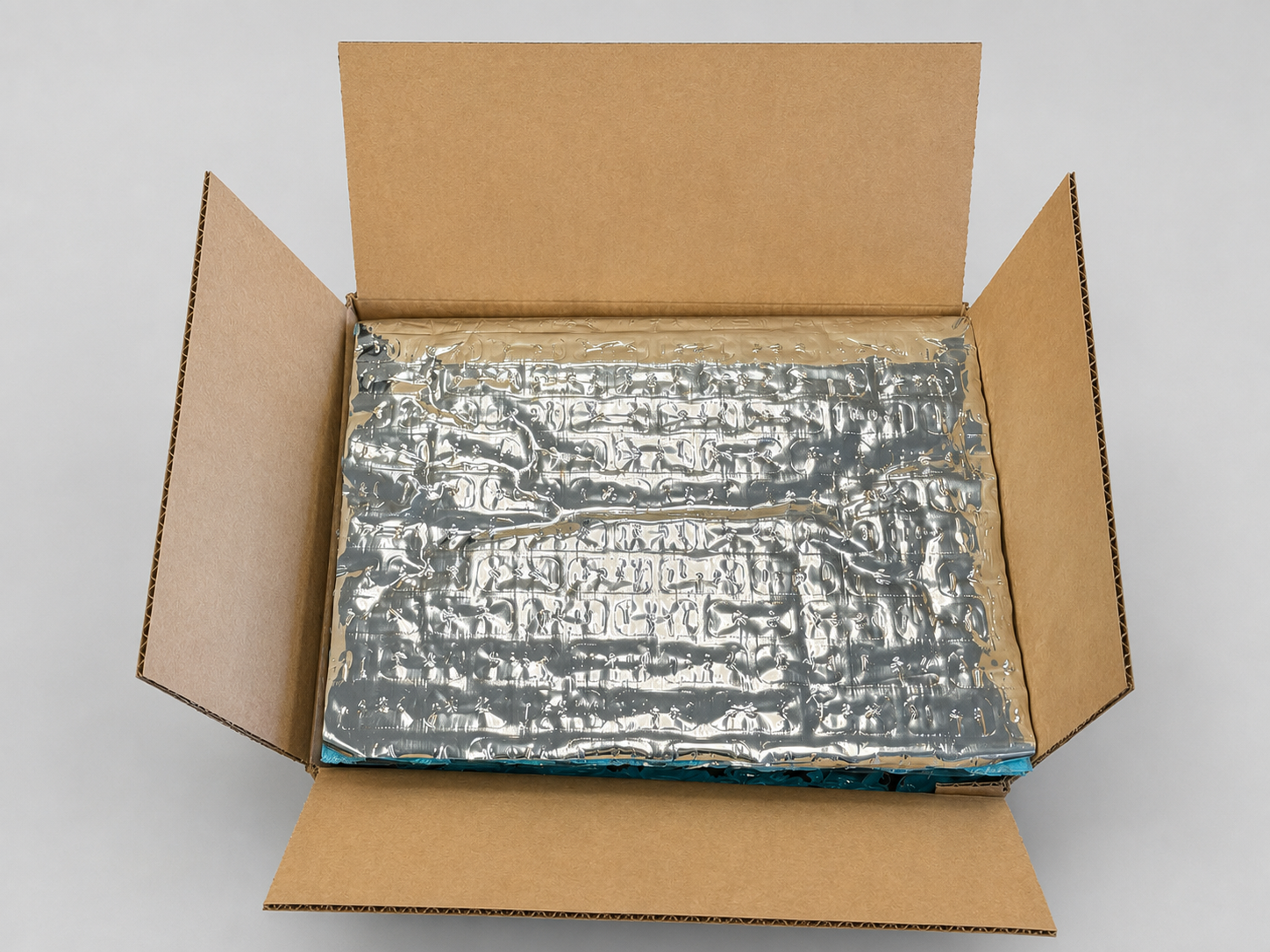Open corrugated shipper with metalized Thermoloc insulation surface