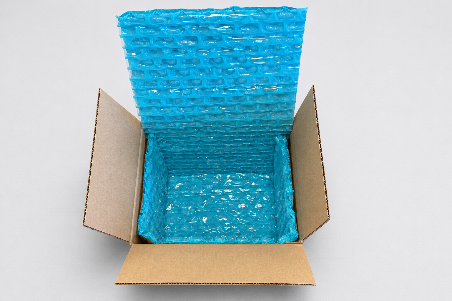 Open corrugated shipper fitted with blue Thermoloc insulation